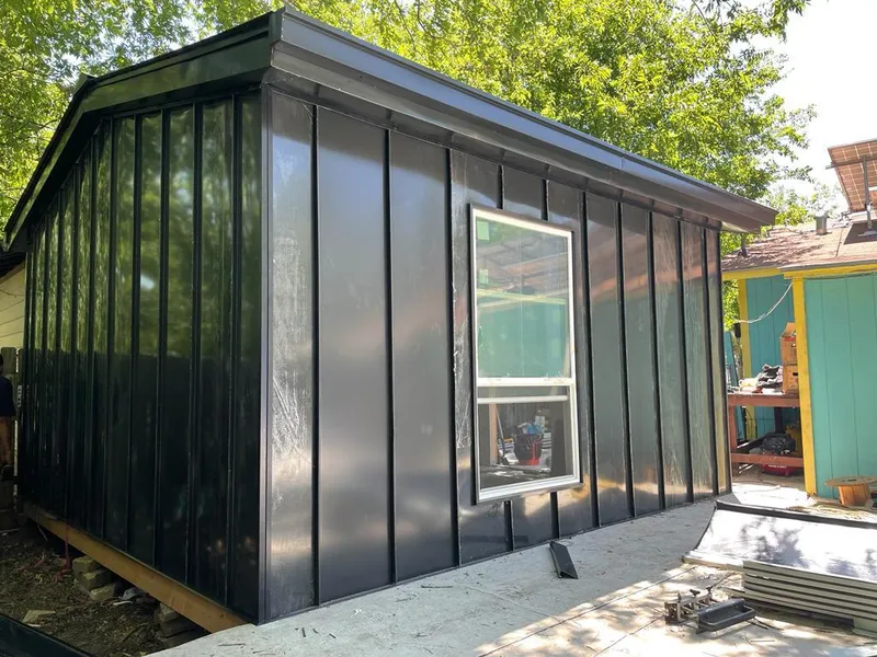 Black standing seam metal wall panels for Roof Inspection in Grandview